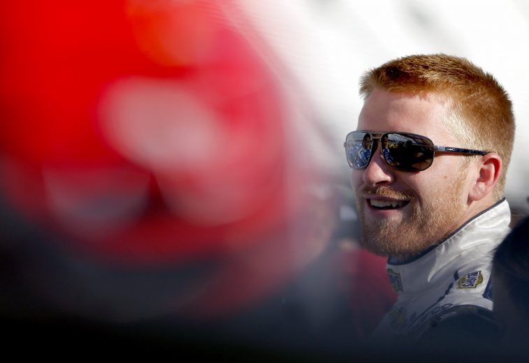 BRISTOL, TENNESSEE - AUGUST 16: Chris Buescher, driver of the #37 Bush's Beans Chevrolet, stands on the grid during qualifying for the Monster Energy NASCAR Cup Series Bass Pro Shops NRA Night Race at Bristol Motor Speedway on August 16, 2019 in Bristol, Tennessee. (Photo by Brian Lawdermilk/Getty Images) | Getty Images