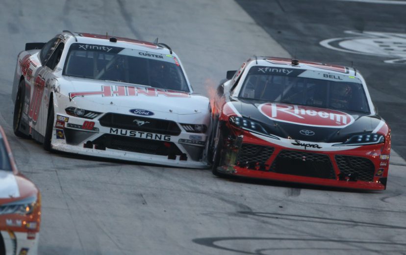 BRISTOL, TENNESSEE - AUGUST 16: Cole Custer, driver of the #00 Haas Automation Ford, and Christopher Bell, driver of the #20 Rheem-HtPG Refrigeration Products Toyota, race during the NASCAR Xfinity Series Food City 300 at Bristol Motor Speedway on August 16, 2019 in Bristol, Tennessee. (Photo by Brian Lawdermilk/Getty Images) | Getty Images