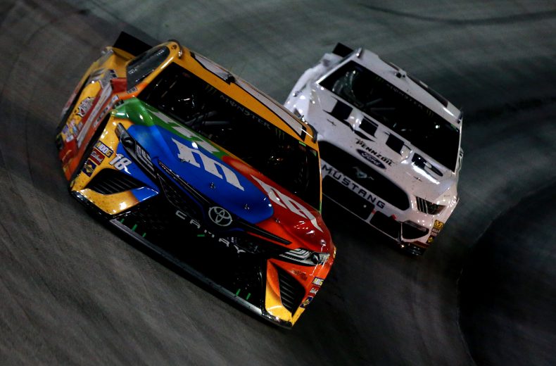 BRISTOL, TENNESSEE - AUGUST 17: Kyle Busch, driver of the #18 M&M's Toyota, leads, Brad Keselowski, driver of the #2 Miller Lite Ford, during the Monster Energy NASCAR Cup Series Bass Pro Shops NRA Night Race at Bristol Motor Speedway on August 17, 2019 in Bristol, Tennessee. (Photo by Sean Gardner/Getty Images) | Getty Images
