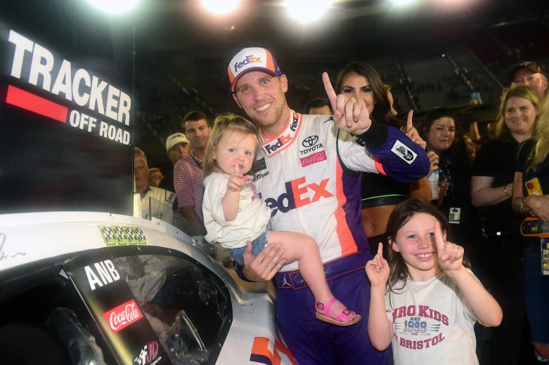 BRISTOL, TENNESSEE - AUGUST 17: Denny Hamlin, driver of the #11 FedEx Freight Toyota, celebrates with his daughters Taylor(R) and Molly in Victory Lane after winning the Monster Energy NASCAR Cup Series Bass Pro Shops NRA Night Race at Bristol Motor Speedway on August 17, 2019 in Bristol, Tennessee. (Photo by Jared C. Tilton/Getty Images) | Getty Images
