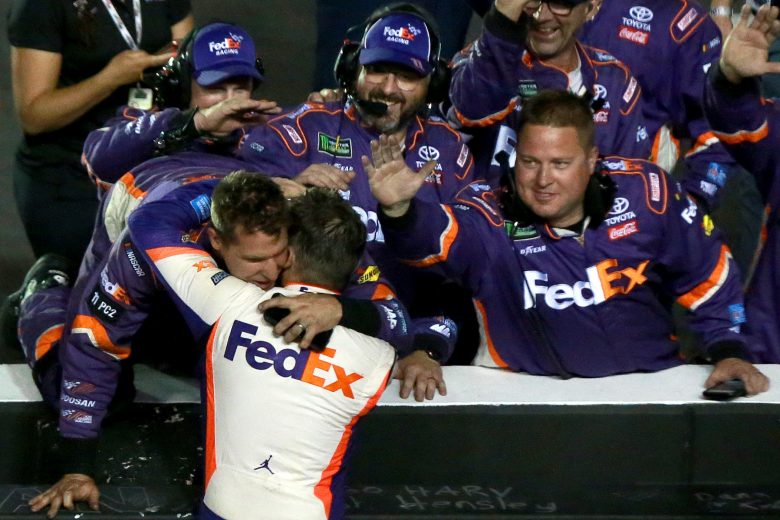 BRISTOL, TENNESSEE - AUGUST 17: Denny Hamlin, driver of the #11 FedEx Freight Toyota, celebrates with his team after winning the Monster Energy NASCAR Cup Series Bass Pro Shops NRA Night Race at Bristol Motor Speedway on August 17, 2019 in Bristol, Tennessee. (Photo by Sean Gardner/Getty Images) | Getty Images