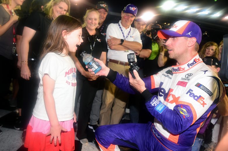 BRISTOL, TENNESSEE - AUGUST 17: Denny Hamlin, driver of the #11 FedEx Freight Toyota, celebrates with his daughter, Taylor, in Victory Lane after winning the Monster Energy NASCAR Cup Series Bass Pro Shops NRA Night Race at Bristol Motor Speedway on August 17, 2019 in Bristol, Tennessee. (Photo by Jared C. Tilton/Getty Images) | Getty Images