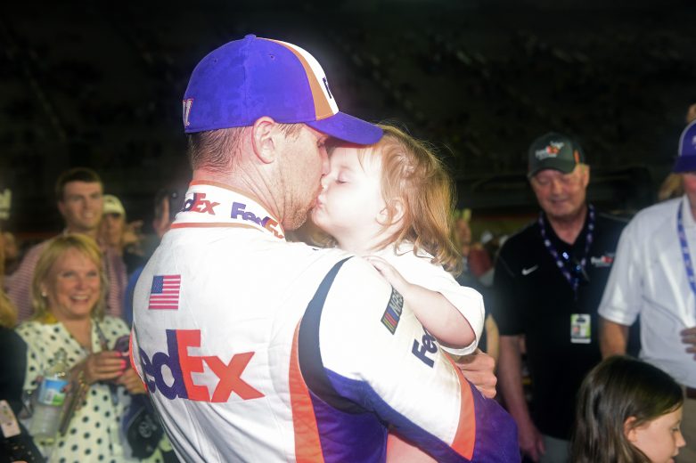 BRISTOL, TENNESSEE - AUGUST 17: Denny Hamlin, driver of the #11 FedEx Freight Toyota, celebrates with his daughter, Molly, in Victory Lane after winning the Monster Energy NASCAR Cup Series Bass Pro Shops NRA Night Race at Bristol Motor Speedway on August 17, 2019 in Bristol, Tennessee. (Photo by Jared C. Tilton/Getty Images) | Getty Images