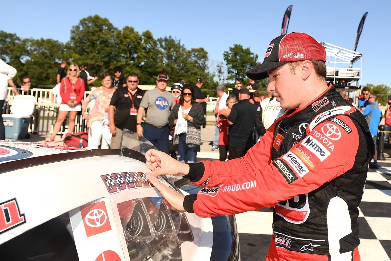 ELKHART LAKE, WISCONSIN - AUGUST 24: Christopher Bell, driver of the #20 Rudd Toyota, applies the winner's sticker after winning the NASCAR Xfinity Series CTECH Manufacturing 180 at Road America on August 24, 2019 in Elkhart Lake, Wisconsin. (Photo by Stacy Revere/Getty Images) | Getty Images