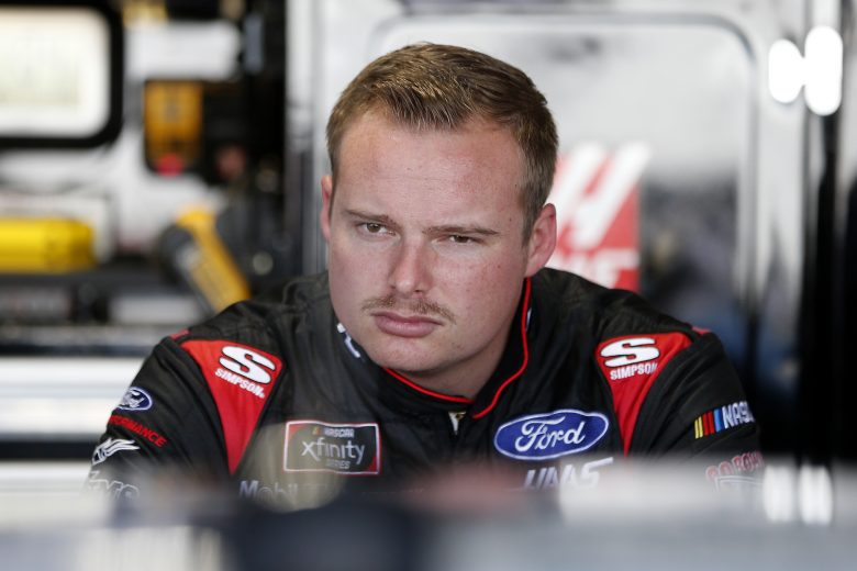 DARLINGTON, SOUTH CAROLINA - AUGUST 30: Cole Custer, driver of the #00 Production Alliance Group Ford, stands in the garage area during practice for the NASCAR Xfinity Series Sport Clips Haircuts VFW 200 at Darlington Raceway on August 30, 2019 in Darlington, South Carolina. (Photo by Brian Lawdermilk/Getty Images) | Getty Images