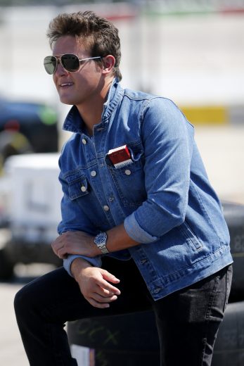 DARLINGTON, SOUTH CAROLINA - AUGUST 30: Gray Gaulding, driver of the #08 DBAutomotive.com Chevrolet, stands in the garage area during practice for the NASCAR Xfinity Series Sport Clips Haircuts VFW 200 at Darlington Raceway on August 30, 2019 in Darlington, South Carolina. (Photo by Brian Lawdermilk/Getty Images) | Getty Images