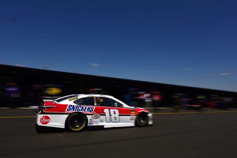 DARLINGTON, SOUTH CAROLINA - AUGUST 30: Kyle Busch drives the #18 Snickers Throwback Toyota through the garage area during practice for the Monster Energy NASCAR Cup Series Bojangles' Southern 500 at Darlington Raceway on August 30, 2019 in Darlington, South Carolina. (Photo by Jared C. Tilton/Getty Images) | Getty Images