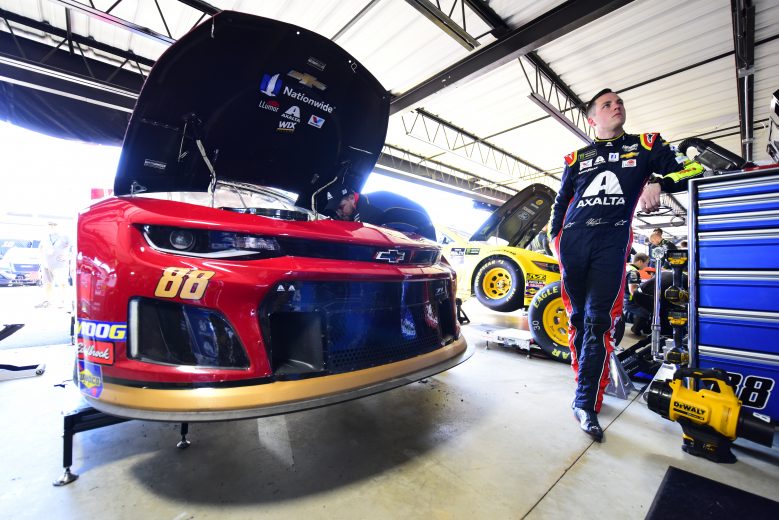 DARLINGTON, SOUTH CAROLINA - AUGUST 30: Alex Bowman, driver of the #88 Axalta Throwback Chevrolet, stands in the garage area during practice for the Monster Energy NASCAR Cup Series Bojangles' Southern 500 at Darlington Raceway on August 30, 2019 in Darlington, South Carolina. (Photo by Jared C. Tilton/Getty Images) | Getty Images