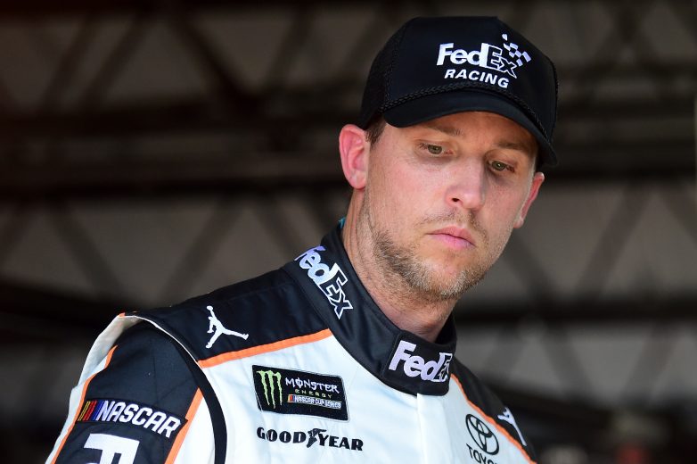 DARLINGTON, SOUTH CAROLINA - AUGUST 30: Denny Hamlin, driver of the #11 FedEx Darlington Throwback Toyota, looks on during practice for the Monster Energy NASCAR Cup Series Bojangles' Southern 500 at Darlington Raceway on August 30, 2019 in Darlington, South Carolina. (Photo by Jared C. Tilton/Getty Images) | Getty Images