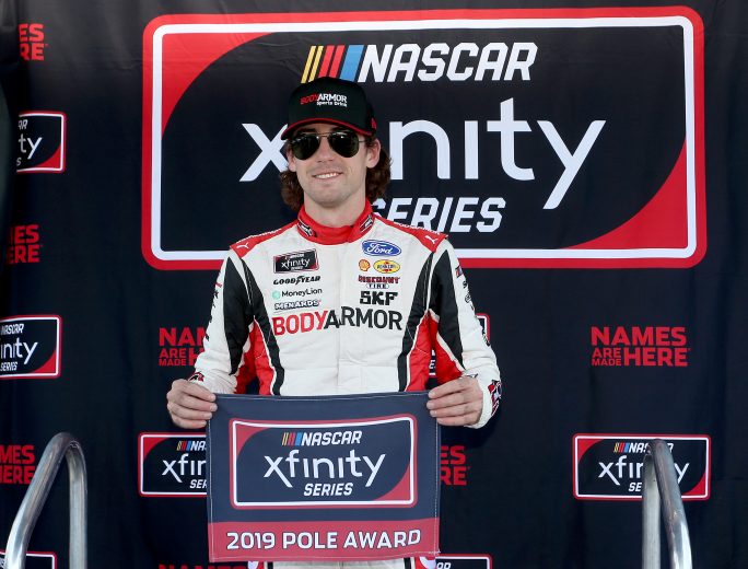 DARLINGTON, SOUTH CAROLINA - AUGUST 31: Ryan Blaney, driver of the #12 BodyArmor Ford, celebrates with the Pole Award afte qualifying for the NASCAR Xfinity Series Sport Clips Haircuts VFW 200 at Darlington Raceway on August 31, 2019 in Darlington, South Carolina. (Photo by Brian Lawdermilk/Getty Images) | Getty Images