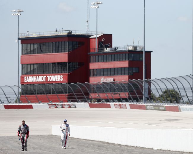 DARLINGTON, SOUTH CAROLINA - AUGUST 31: Cole Custer, driver of the #00 Production Alliance Group Ford, and Chase Briscoe, driver of the #98 Ford Performance Ford, walk down pit road during qualifying for the NASCAR Xfinity Series Sport Clips Haircuts VFW 200 at Darlington Raceway on August 31, 2019 in Darlington, South Carolina. (Photo by Brian Lawdermilk/Getty Images) | Getty Images