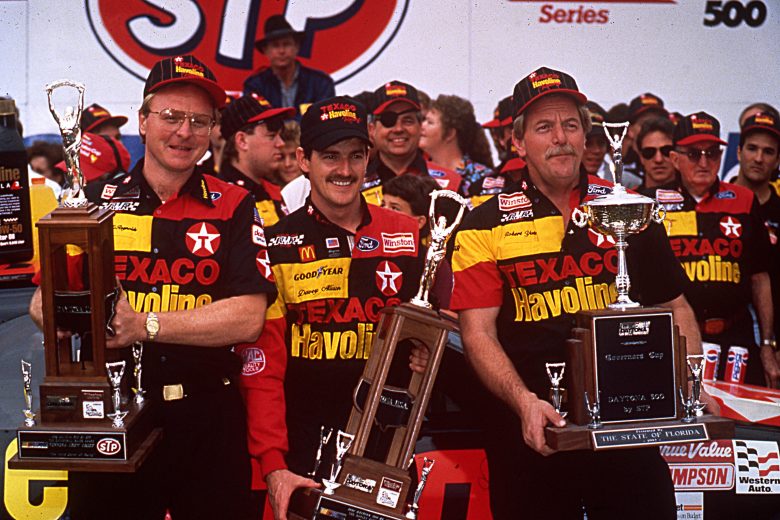 DAYTONA BEACH, FL — February 16, 1992:  Davey Allison (C) celebrates in victory lane at Daytona International Speedway with crew chief Larry McReynolds (L) and car owner Robert Yates (R) after winning the Daytona 500 NASCAR Cup race.  (Photo by ISC Images & Archives via Getty Images)