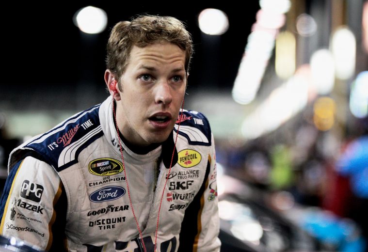 HOMESTEAD, FL - NOVEMBER 14:  Brad Keselowski, driver of the #2 Miller Lite Ford, stands on the grid during qualifying for the NASCAR Sprint Cup Series Ford EcoBoost 400 at Homestead-Miami Speedway on November 14, 2014 in Homestead, Florida.  (Photo by Sean Gardner/Getty Images) | Getty Images