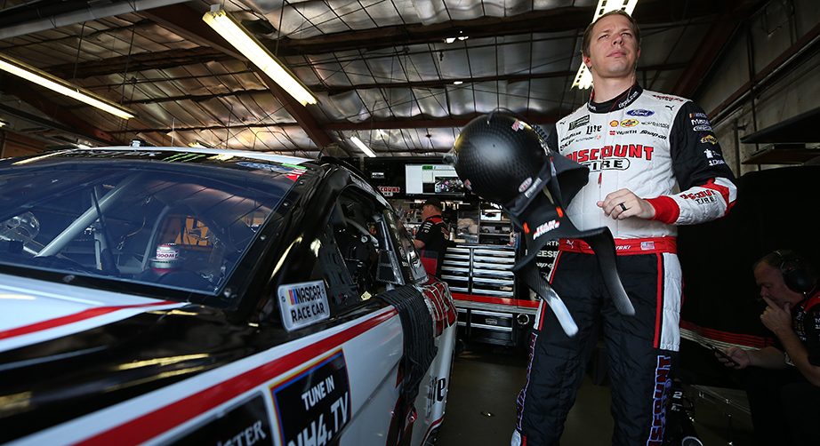 BROOKLYN, MICHIGAN - AUGUST 10: Brad Keselowski, driver of the #2 Discount Tire Ford, gets into his car during practice for the Monster Energy NASCAR Cup Series Consumers Energy 400 at Michigan International Speedway on August 10, 2019 in Brooklyn, Michigan. (Photo by Matt Sullivan/Getty Images) | Getty Images