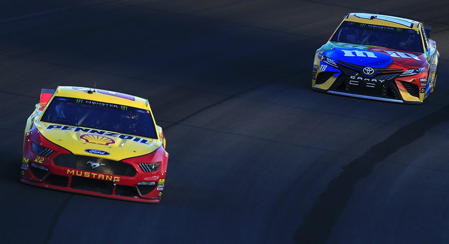 SPARTA, KENTUCKY - JULY 13: Joey Logano, driver of the #22 Shell Pennzoil Ford, and Kyle Busch, driver of the #18 M&M's Toyota Camry Toyota, race during the Monster Energy NASCAR Cup Series Quaker State 400 Presented by Walmart at Kentucky Speedway on July 13, 2019 in Sparta, Kentucky. (Photo by Daniel Shirey/Getty Images)