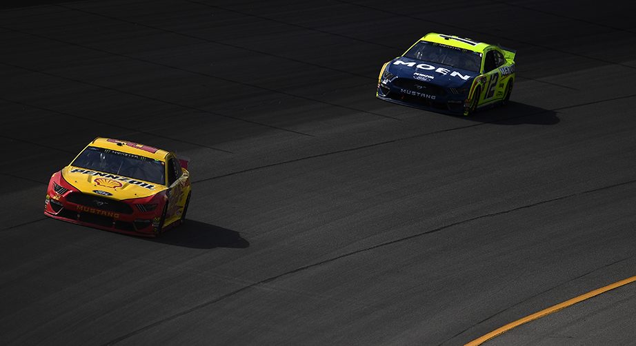 BROOKLYN, MICHIGAN - AUGUST 11: Joey Logano, driver of the #22 Shell Pennzoil Ford, leads Ryan Blaney, driver of the #12 Menards/Moen Ford, during the Monster Energy NASCAR Cup Series Consumers Energy 400 at Michigan International Speedway on August 11, 2019 in Brooklyn, Michigan. (Photo by Stacy Revere/Getty Images) | Getty Images