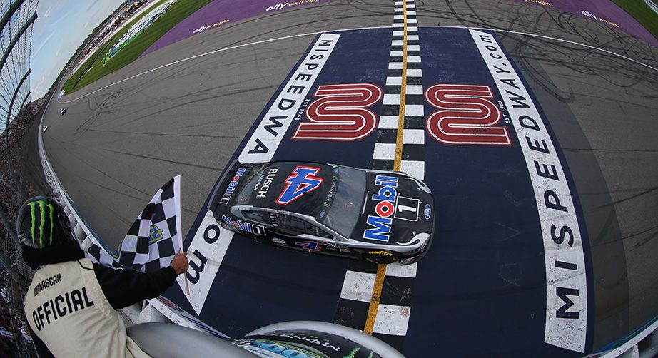 BROOKLYN, MICHIGAN - AUGUST 11: Kevin Harvick, driver of the #4 Mobil 1 Ford, takes the checkered flag to win the Monster Energy NASCAR Cup Series Consumers Energy 400 at Michigan International Speedway on August 11, 2019 in Brooklyn, Michigan. (Photo by Matt Sullivan/Getty Images) | Getty Images