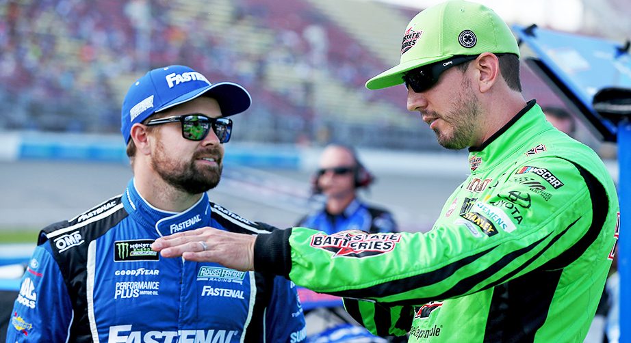 BROOKLYN, MICHIGAN - AUGUST 09: Ricky Stenhouse Jr, driver of the #17 Fastenal Ford, talks with Kyle Busch, driver of the #18 Interstate Batteries Toyota, during qualifying for the Monster Energy NASCAR Cup Series Consumers Energy 400 at Michigan International Speedway on August 09, 2019 in Brooklyn, Michigan. (Photo by Matt Sullivan/Getty Images) | Getty Images