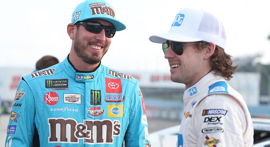 WATKINS GLEN, NEW YORK - AUGUST 03: Kyle Busch, driver of the #18 M&M's Hazelnut Toyota, talks with Ryan Blaney, driver of the #12 PPG Ford, during qualifying for the Monster Energy NASCAR Cup Series Go Bowling at The Glen at Watkins Glen International on August 03, 2019 in Watkins Glen, New York. (Photo by Matt Sullivan/Getty Images) | Getty Images
