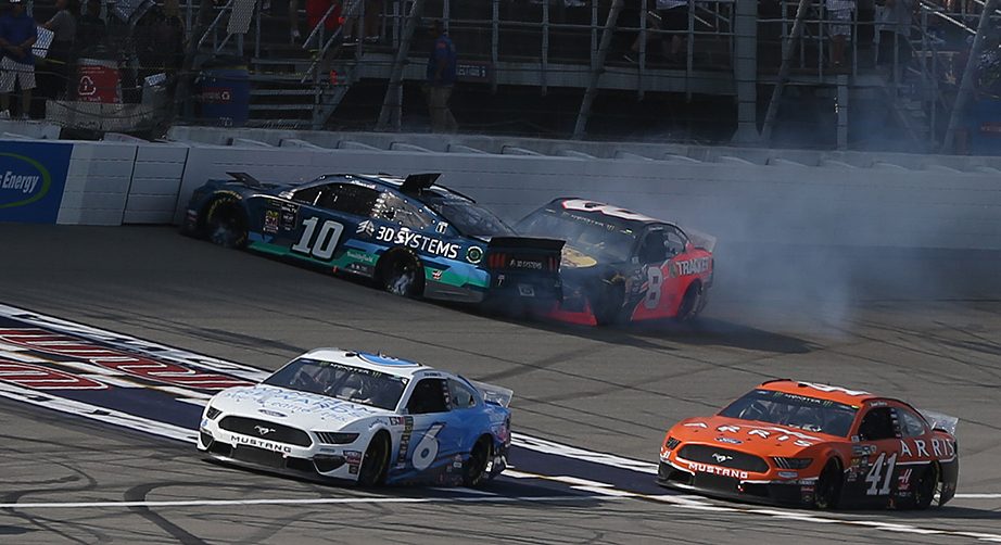 BROOKLYN, MICHIGAN - AUGUST 11: Aric Almirola, driver of the #10 3D Systems Ford, and Daniel Hemric, driver of the #8 Bass Pro Shops/Tracker Boats Chevrolet, are involved in an on-track incident during the Monster Energy NASCAR Cup Series Consumers Energy 400 at Michigan International Speedway on August 11, 2019 in Brooklyn, Michigan. (Photo by Matt Sullivan/Getty Images) | Getty Images