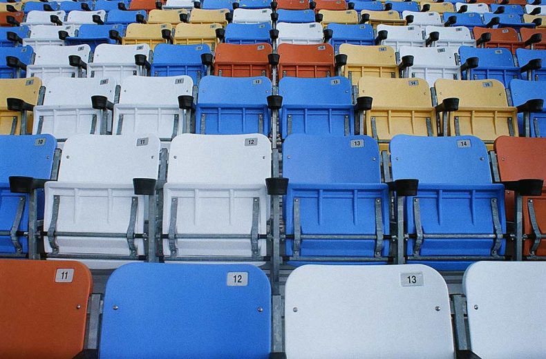 The colorful array of seats in the Darlington Raceway main grandstand.