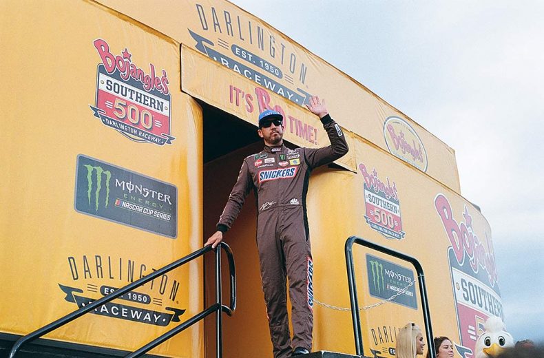Kyle Busch waves to the crowd in driver introductions at Darlington Raceway