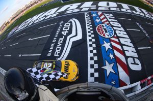 CONCORD, NORTH CAROLINA - OCTOBER 09: Christopher Bell, driver of the #20 DeWalt Toyota, takes the checkered flag to win the NASCAR Cup Series Bank of America Roval 400 at Charlotte Motor Speedway on October 09, 2022 in Concord, North Carolina. (Photo by Mike Mulholland/Getty Images) | Getty Images