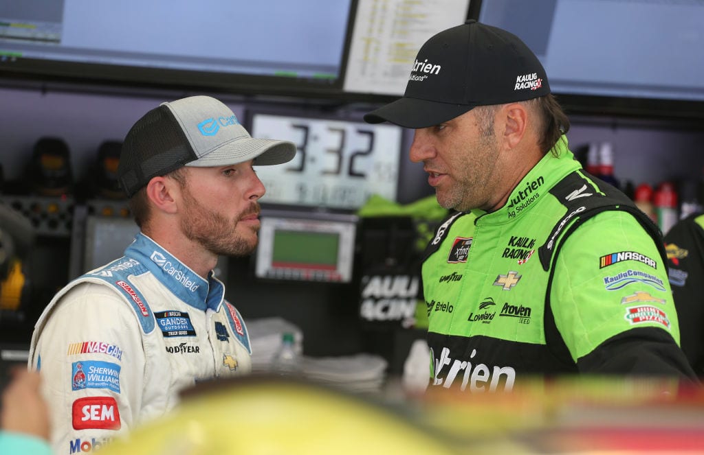 LAS VEGAS, NEVADA - SEPTEMBER 13: Elliott Sadler, driver of the #10 Nutrien Ag Solutions Chevrolet, talks with Ross Chastain, driver of the #45 CarShield Chevrolet, during practice for the NASCAR Xfinity Series Rhino Pro Truck Outfitters 300 at Las Vegas Motor Speedway on September 13, 2019 in Las Vegas, Nevada. (Photo by Matt Sullivan/Getty Images) | Getty Images