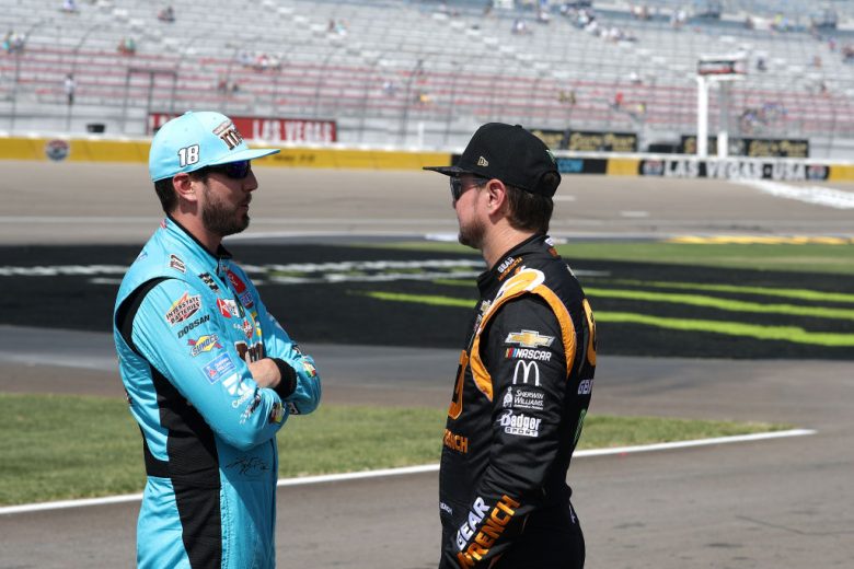 LAS VEGAS, NEVADA - SEPTEMBER 14: Kyle Busch, driver of the #18 M&M's Hazelnut Toyota, talks with Kurt Busch, driver of the #1 GEARWRENCH Chevrolet, during qualifying for the Monster Energy NASCAR Cup Series South Point 400 at Las Vegas Motor Speedway on September 14, 2019 in Las Vegas, Nevada. (Photo by Chris Graythen/Getty Images) | Getty Images