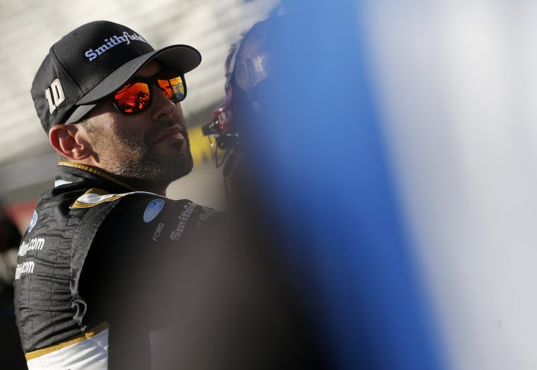BRISTOL, TENNESSEE - AUGUST 16: Aric Almirola, driver of the #10 Smithfield Ford, stands on the grid during qualifying for the Monster Energy NASCAR Cup Series Bass Pro Shops NRA Night Race at Bristol Motor Speedway on August 16, 2019 in Bristol, Tennessee. (Photo by Brian Lawdermilk/Getty Images) | Getty Images