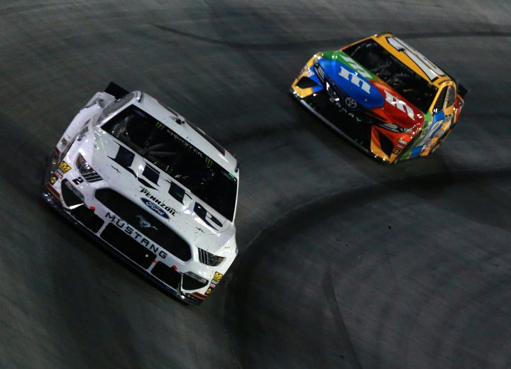 BRISTOL, TENNESSEE - AUGUST 17: Brad Keselowski, driver of the #2 Miller Lite Ford, leads Kyle Busch, driver of the #18 M&M's Toyota, during the Monster Energy NASCAR Cup Series Bass Pro Shops NRA Night Race at Bristol Motor Speedway on August 17, 2019 in Bristol, Tennessee. (Photo by Sean Gardner/Getty Images) | Getty Images