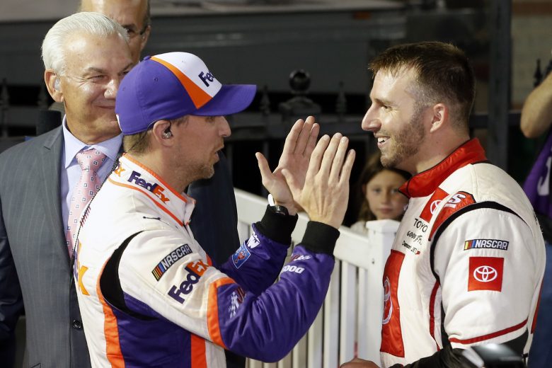 BRISTOL, TENNESSEE - AUGUST 17: Denny Hamlin(L), driver of the #11 FedEx Freight Toyota, speaks with Matt DiBenedetto, driver of the #95 Toyota Express Maintenance Toyota, in Victory Lane after winning the Monster Energy NASCAR Cup Series Bass Pro Shops NRA Night Race at Bristol Motor Speedway on August 17, 2019 in Bristol, Tennessee. DiBenedetto was passed by Hamlin in the closing laps and finished runner-up. (Photo by Brian Lawdermilk/Getty Images) | Getty Images