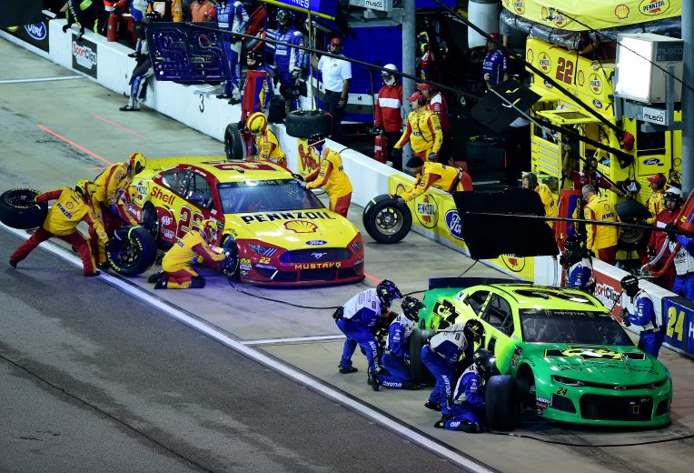 DARLINGTON, SOUTH CAROLINA - SEPTEMBER 01: William Byron, driver of the #24 HendrickAutoguard/CityChvrltThrwbck Chev, and Joey Logano, driver of the #22 Shell Pennzoil Ford, pit during the Monster Energy NASCAR Cup Series Bojangles' Southern 500 at Darlington Raceway on September 01, 2019 in Darlington, South Carolina. (Photo by Jared C. Tilton/Getty Images) | Getty Images