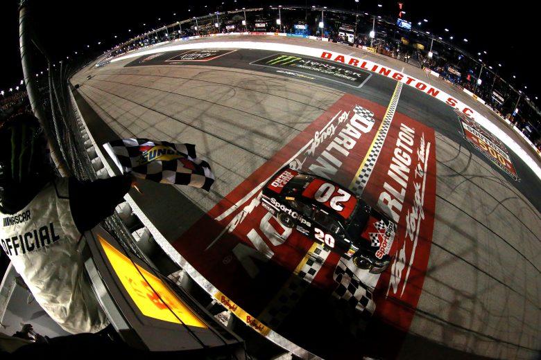 DARLINGTON, SOUTH CAROLINA - SEPTEMBER 02: Erik Jones, driver of the #20 Sport Clips Throwback Toyota, takes the checkered flag to win the Monster Energy NASCAR Cup Series Bojangles' Southern 500 at Darlington Raceway on September 02, 2019 in Darlington, South Carolina. (Photo by Sean Gardner/Getty Images) | Getty Images