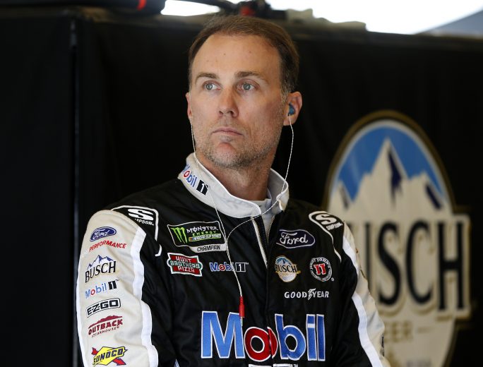 INDIANAPOLIS, INDIANA - SEPTEMBER 07: Kevin Harvick, driver of the #4 Mobil 1 Ford, stands in the garage area during practice for the Monster Energy NASCAR Cup Series Big Machine Vodka 400 at Indianapolis Motor Speedway on September 07, 2019 in Indianapolis, Indiana. (Photo by Brian Lawdermilk/Getty Images) | Getty Images