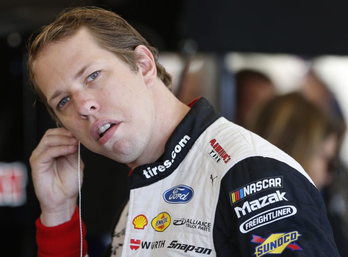 RICHMOND, VIRGINIA - SEPTEMBER 20: Brad Keselowski, driver of the #2 Discount Tire Ford, stands in the garage area during practice for the Monster Energy NASCAR Cup Series Federated Auto Parts 400 at Richmond Raceway on September 20, 2019 in Richmond, Virginia. (Photo by Brian Lawdermilk/Getty Images) | Getty Images