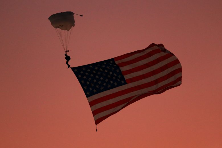 RICHMOND, VIRGINIA - SEPTEMBER 21: A sky diver lands with the American flag prior to the start during the Monster Energy NASCAR Cup Series Federated Auto Parts 400 at Richmond Raceway on September 21, 2019 in Richmond, Virginia. (Photo by Sean Gardner/Getty Images) | Getty Images