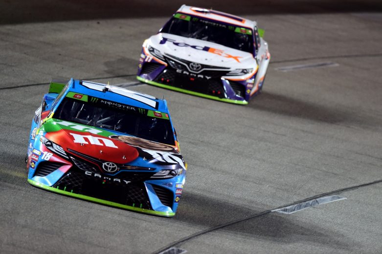 RICHMOND, VIRGINIA - SEPTEMBER 21: Kyle Busch, driver of the #18 M&M's Hazelnut Toyota, leads Denny Hamlin, driver of the #11 FedEx Office Toyota, during the Monster Energy NASCAR Cup Series Federated Auto Parts 400 at Richmond Raceway on September 21, 2019 in Richmond, Virginia. (Photo by Jared C. Tilton/Getty Images) | Getty Images