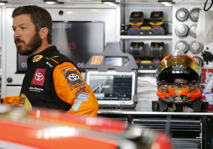 CHARLOTTE, NORTH CAROLINA - SEPTEMBER 27: Martin Truex Jr., driver of the #19 Bass Pro Shops Toyota, stands in the garage area during practice for the Monster Energy NASCAR Cup Series Bank of America ROVAL 400 at Charlotte Motor Speedway on September 27, 2019 in Charlotte, North Carolina. (Photo by Brian Lawdermilk/Getty Images) | Getty Images
