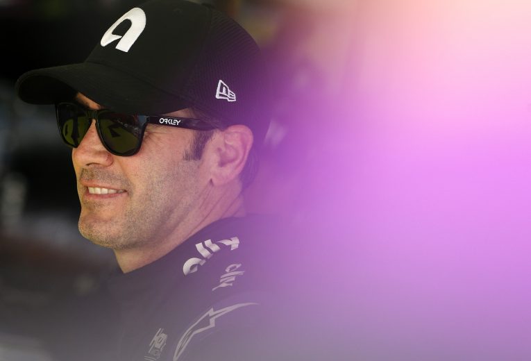 CHARLOTTE, NORTH CAROLINA - SEPTEMBER 28: Jimmie Johnson, driver of the #48 Ally Chevrolet, stands in the garage area during practice for the Monster Energy NASCAR Cup Series Bank of America ROVAL 400 at Charlotte Motor Speedway on September 28, 2019 in Charlotte, North Carolina. (Photo by Brian Lawdermilk/Getty Images) | Getty Images