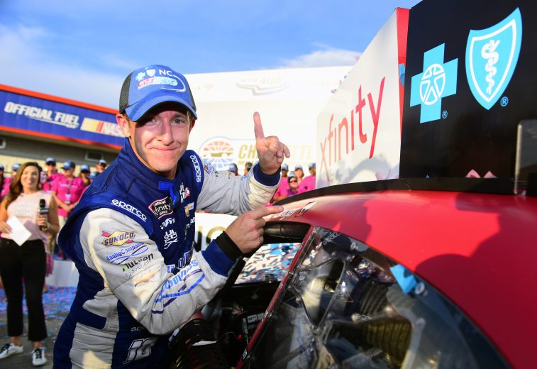 CHARLOTTE, NORTH CAROLINA - SEPTEMBER 28: A J Allmendinger, driver of the #10 Digital Ally Chevrolet, poses with the winner’s decal on his car in Victory Lane after winning the NASCAR Xfinity Series Drive for the Cure 250 presented by Blue Cross Blue Shield of North Carolina at Charlotte Motor Speedway on September 28, 2019 in Charlotte, North Carolina. (Photo by Jared C. Tilton/Getty Images) | Getty Images
