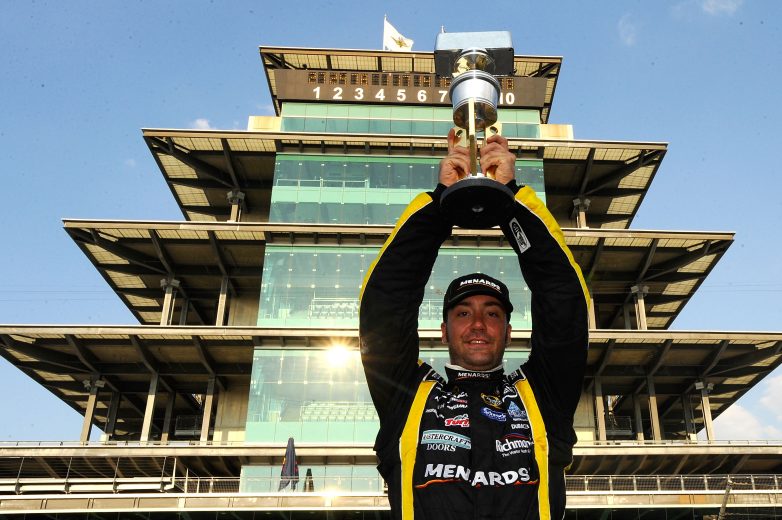 INDIANAPOLIS, IN - JULY 31:  Paul Menard, driver of the #27 NIBCO/Menards Chevrolet, poses with the trophy in front of the pagoda after winning the NASCAR Sprint Cup Series Brickyard 400 at Indianapolis Motor Speedway on July 31, 2011 in Indianapolis, Indiana.  (Photo by Jason Smith/Getty Images for NASCAR) | Getty Images