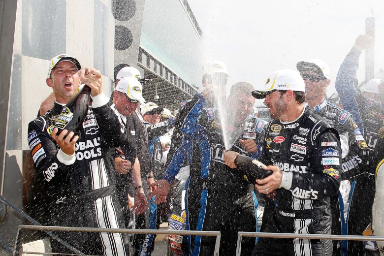 INDIANAPOLIS, IN - JULY 29:  Jimmie Johnson, driver of the #48 Lowe's/Kobalt Tools Chevrolet, and his team celebrate in Victory Lane after winning the NASCAR Sprint Cup Series Crown Royal presents the Curtiss Shaver 400 at the Brickyard at Indianapolis Motor Speedway on July 29, 2012 in Indianapolis, Indiana.  (Photo by Tyler Barrick/Getty Images) | Getty Images