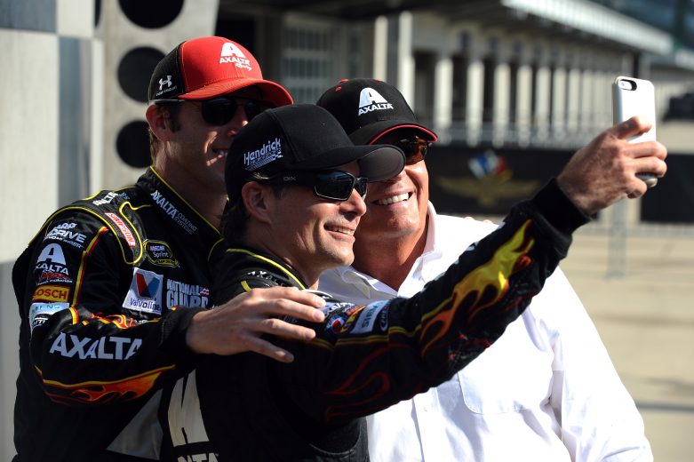 INDIANAPOLIS, IN - JULY 27:  Jeff Gordon, driver of the #24 Axalta Chevrolet, crew chief Alan Gustafson and team owner Rick Hendrick take a selfie in Victory Lane after winning the NASCAR Sprint Cup Series Crown Royal Presents The John Wayne Walding 400 at the Brickyard Indianapolis Motor Speedway on July 27, 2014 in Indianapolis, Indiana.  (Photo by Rainier Ehrhardt/Getty Images) | Getty Images