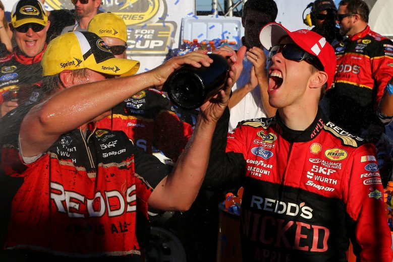 TALLADEGA, AL - OCTOBER 19:  Brad Keselowski, driver of the #2 Redd's Wicked Apple Ale Ford, celebrates in victory lane after winning the NASCAR Sprint Cup Series GEICO 500 at Talladega Superspeedway on October 19, 2014 in Talladega, Alabama.  (Photo by Jonathan Ferrey/Getty Images) | Getty Images