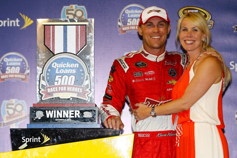 AVONDALE, AZ - NOVEMBER 09:  Kevin Harvick, driver of the #4 Budweiser Chevrolet, celebrates in victory lane with his wife DeLana after winning the NASCAR Sprint Cup Series Quicken Loans Race for Heroes 500 at Phoenix International Raceway on November 9, 2014 in Avondale, Arizona.  (Photo by Jonathan Ferrey/NASCAR via Getty Images)