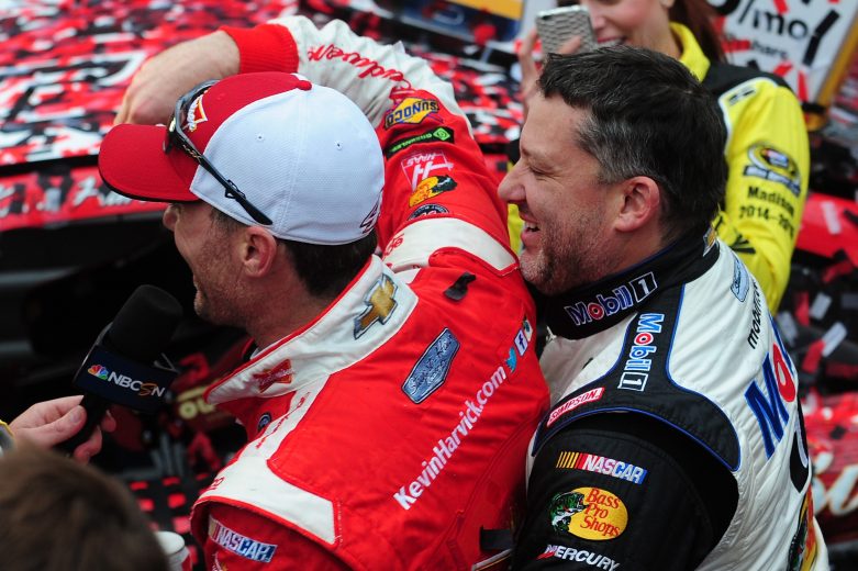 DOVER, DE - OCTOBER 04:  Kevin Harvick, driver of the #4 Budweiser/Jimmy John's Chevrolet, is congratulated by team owner Tony Stewart, driver of the #14 Mobil 1/Bass Pro Shops Chevrolet, in victory lane after winning the NASCAR Sprint Cup Series AAA 400 at Dover International Speedway on October 4, 2015 in Dover, Delaware.  (Photo by Will Schneekloth/Getty Images) | Getty Images