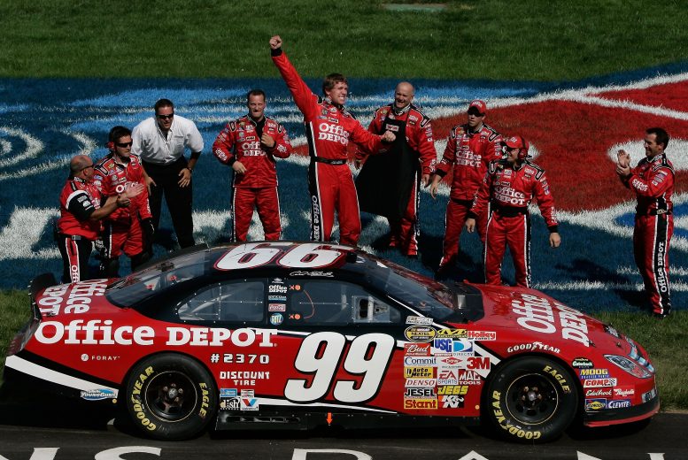 BROOKLYN, MI - JUNE 17: Carl Edwards, driver of the #99 Office Depot Ford, celebrates after winning the NASCAR Nextel Cup Series Citizens Bank 400 at Michigan International Speedway on June 16, 2007 in Brooklyn Michigan. (Photo by Jason Smith/Getty Images for NASCAR) | Getty Images