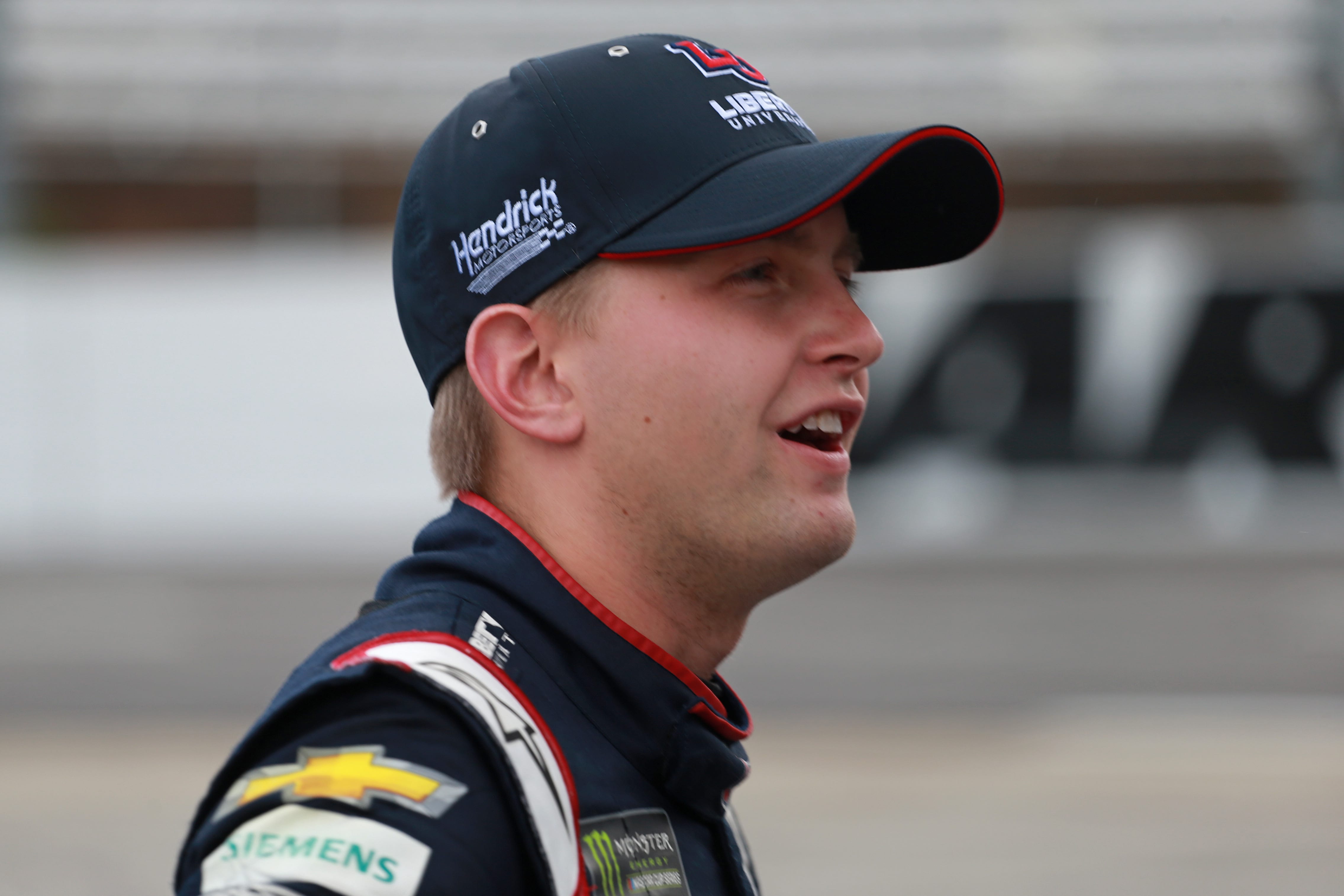 MARTINSVILLE, VIRGINIA - OCTOBER 26: William Byron, driver of the #24 Liberty University Chevrolet, stands by his car during qualifying for the Monster Energy NASCAR Cup Series First Data 500 at Martinsville Speedway on October 26, 2019 in Martinsville, Virginia. (Photo by Matt Sullivan/Getty Images) | Getty Images