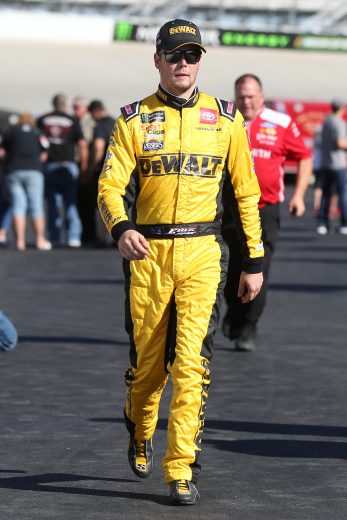 DOVER, DELAWARE - OCTOBER 04: Erik Jones, driver of the #20 DeWalt Toyota, walks to his car during practice for the Monster Energy NASCAR Cup Series Drydene 400 at Dover International Speedway on October 04, 2019 in Dover, Delaware. (Photo by Matt Sullivan/Getty Images) | Getty Images